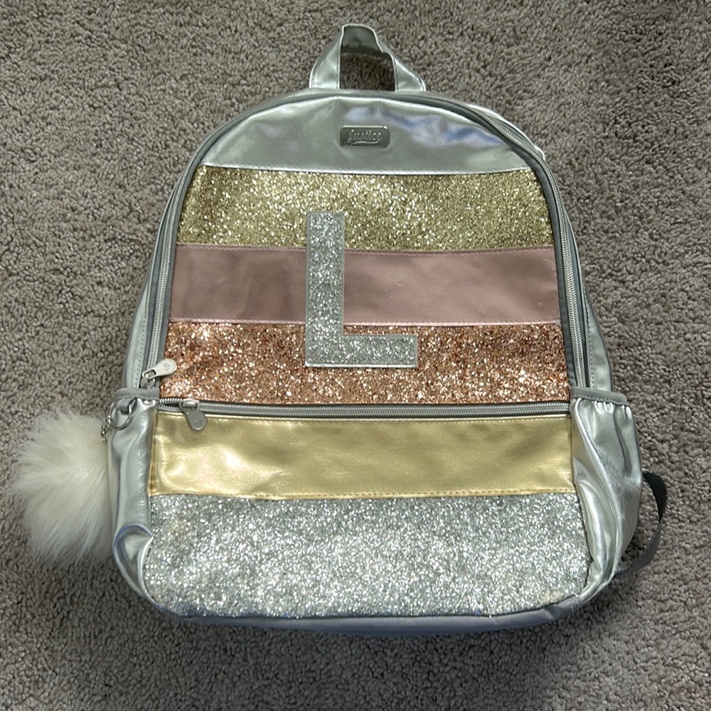 This is an old Justice backpack that my kids can no longer use for school.